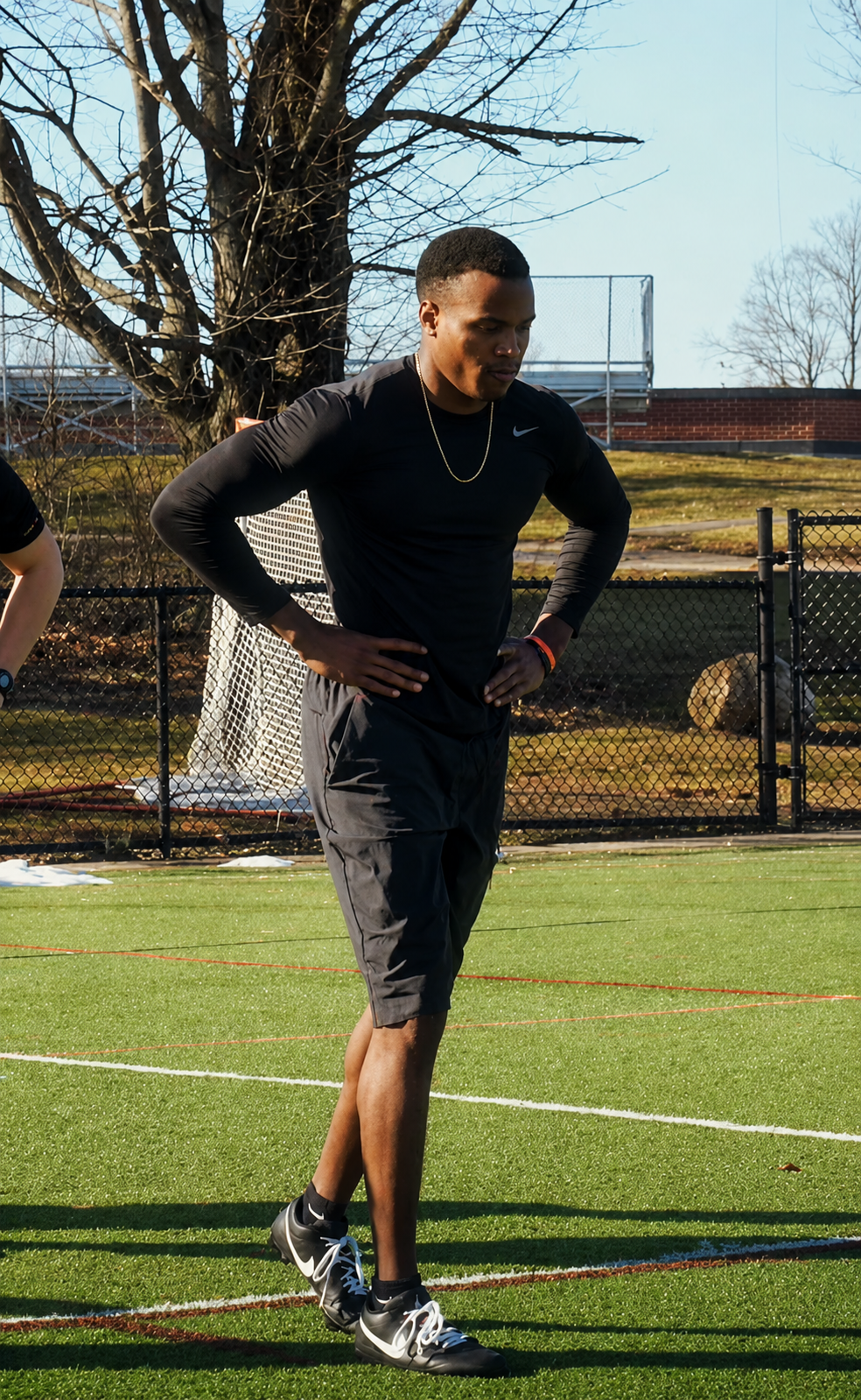 Male athlete training outdoors on a turf field at Overdrive